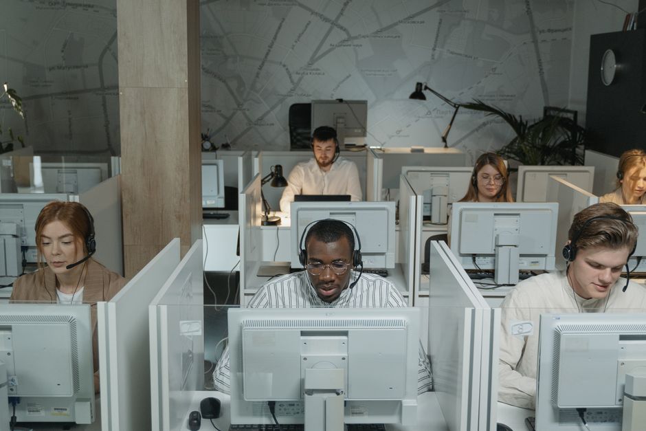 Business team analyzing call recordings to improve service quality - business call recording Business team analyzing call recordings to improve service quality - business call recording